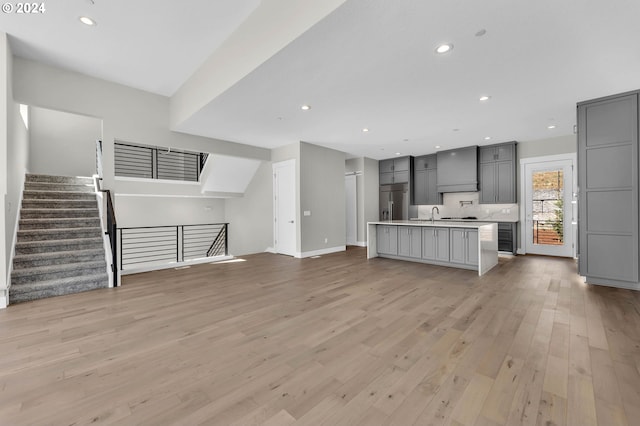 unfurnished living room featuring light wood-type flooring