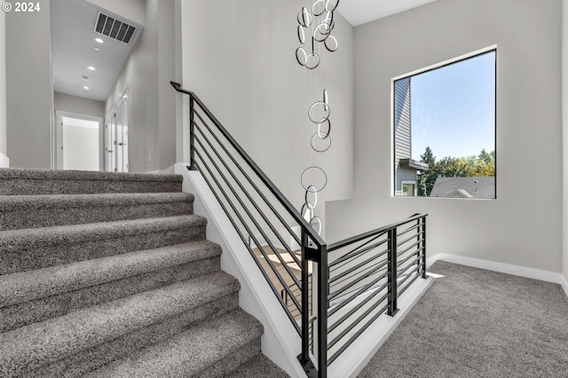 stairway with carpet flooring