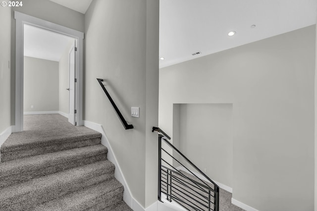 stairway with carpet flooring