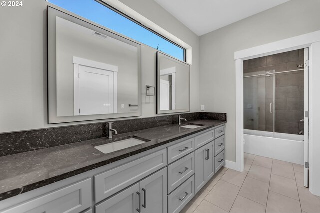 bathroom with shower / bath combination with glass door, vanity, and tile patterned floors