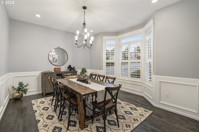 dining area featuring a chandelier and dark hardwood / wood-style floors