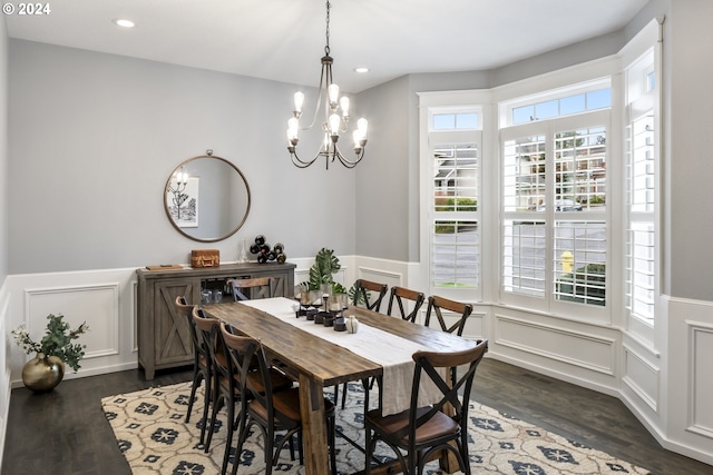 dining area with plenty of natural light and dark hardwood / wood-style flooring