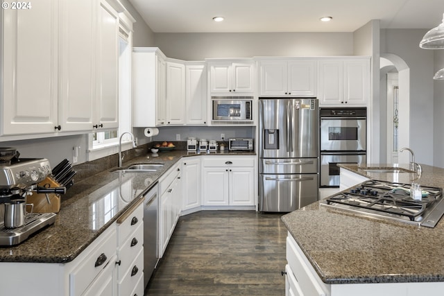 kitchen featuring sink, white cabinets, dark hardwood / wood-style floors, and appliances with stainless steel finishes