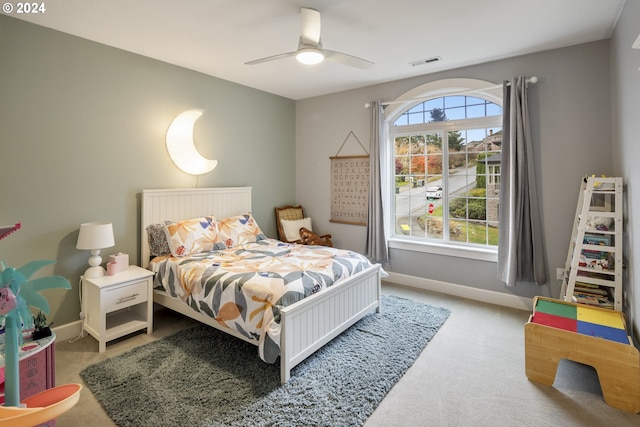 carpeted bedroom with ceiling fan