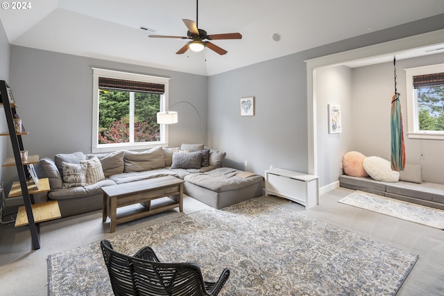 living room with ceiling fan, carpet, and a healthy amount of sunlight