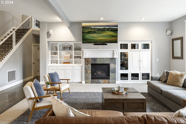 living room featuring a fireplace and hardwood / wood-style floors