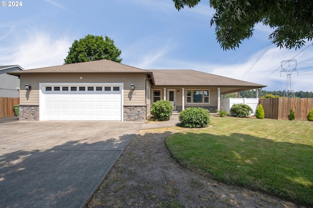 view of front of home featuring a garage and a front lawn