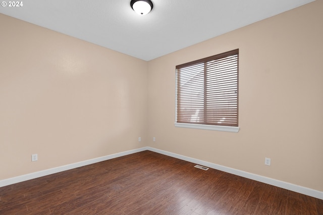 unfurnished room featuring hardwood / wood-style floors