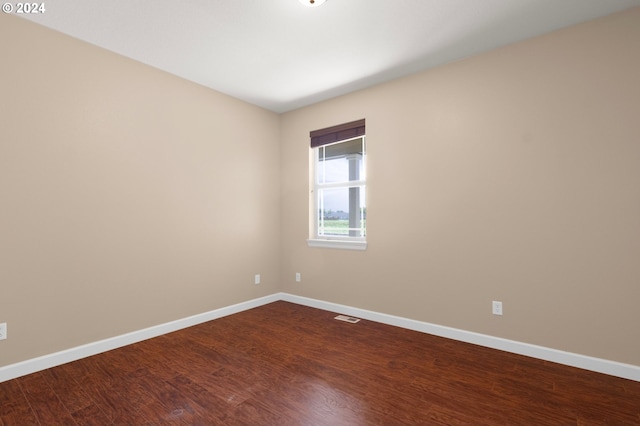 empty room with wood-type flooring