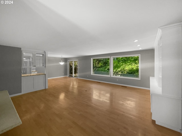 unfurnished living room featuring hardwood / wood-style floors