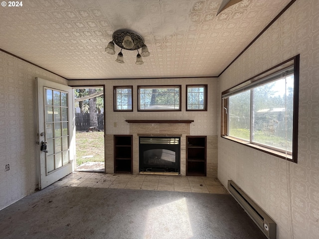 unfurnished living room featuring ornamental molding, baseboard heating, light carpet, and plenty of natural light