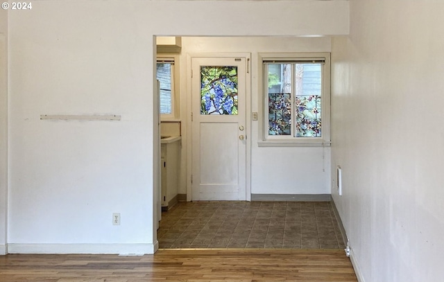 doorway to outside featuring dark hardwood / wood-style floors