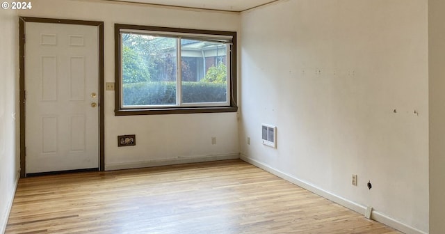 interior space featuring light hardwood / wood-style floors and heating unit