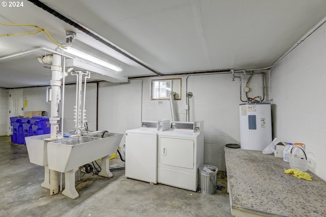 washroom with electric water heater and separate washer and dryer