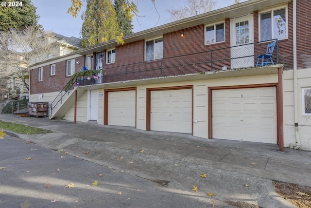 back of house with a garage