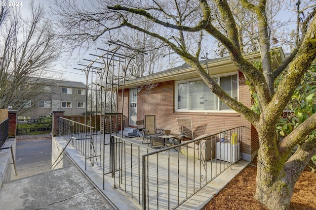 view of home's exterior with a patio