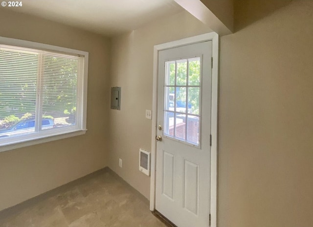 doorway with light carpet and electric panel