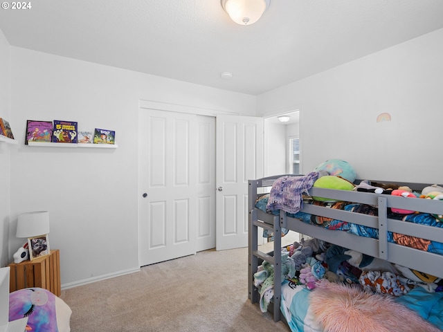 carpeted bedroom featuring a closet