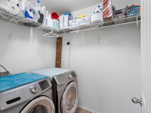 laundry room featuring washing machine and dryer