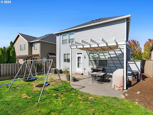 back of property featuring a patio, a pergola, a yard, and central air condition unit