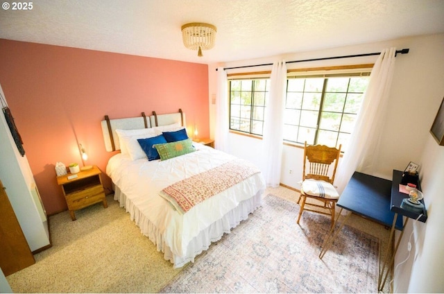 68191 E Twinberry Loop, Welches, OR 97067 - bedroom featuring light carpet and a textured ceiling