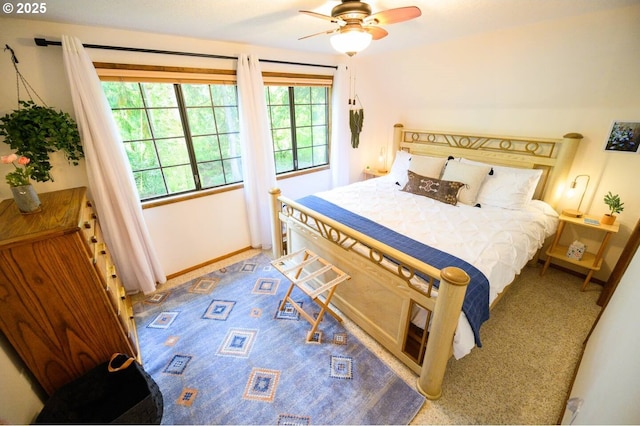 68191 E Twinberry Loop, Welches, OR 97067 - carpeted bedroom featuring baseboards and a ceiling fan