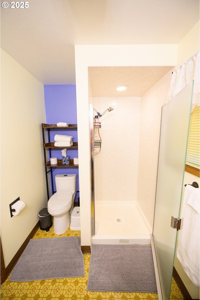 68191 E Twinberry Loop, Welches, OR 97067 - bathroom featuring a shower stall, toilet, and baseboards