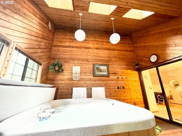 68191 E Twinberry Loop, Welches, OR 97067 - bedroom featuring wood walls, wood ceiling, and wood finished floors