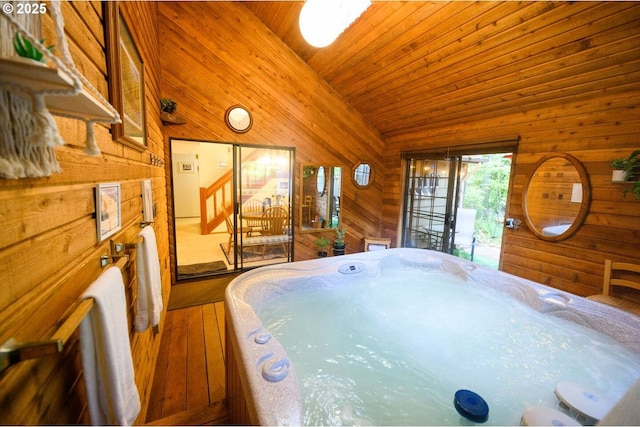 68191 E Twinberry Loop, Welches, OR 97067 - misc room featuring a hot tub, wood walls, lofted ceiling, and wood finished floors