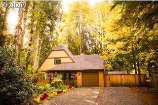 68191 E Twinberry Loop, Welches, OR 97067 - view of front of property with concrete driveway and an attached garage