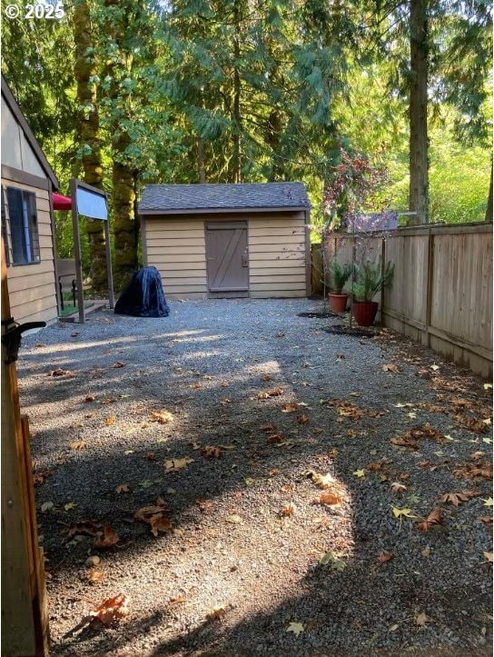 68191 E Twinberry Loop, Welches, OR 97067 - garage featuring a storage shed