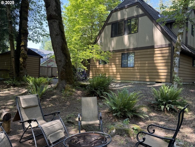 68191 E Twinberry Loop, Welches, OR 97067 - back of house featuring a fire pit