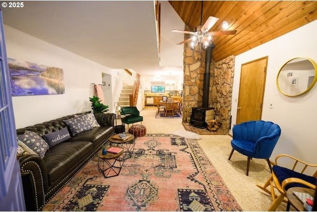 68191 E Twinberry Loop, Welches, OR 97067 - carpeted living area with a wood stove, ceiling fan, and stairs