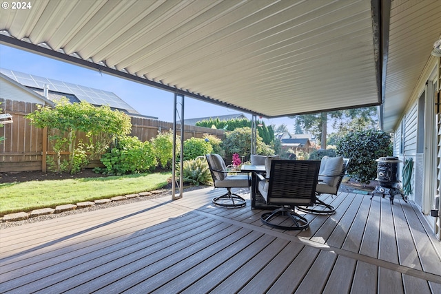 wooden terrace with a yard