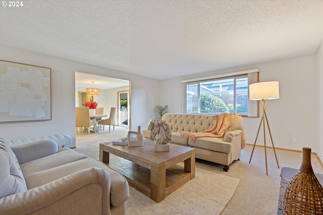 carpeted living room featuring a textured ceiling