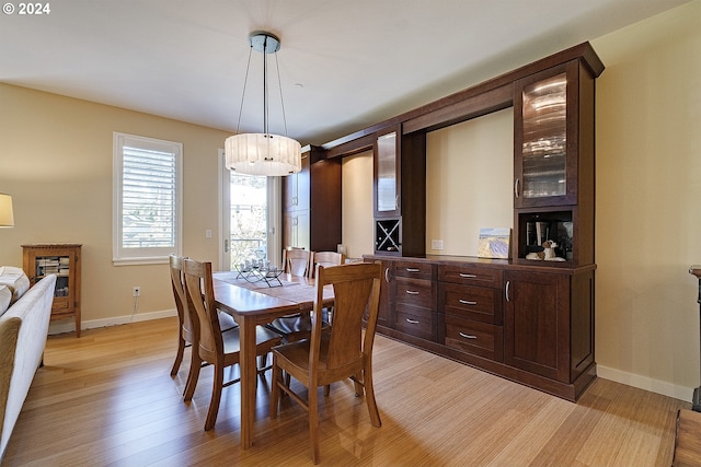 dining space featuring light hardwood / wood-style floors