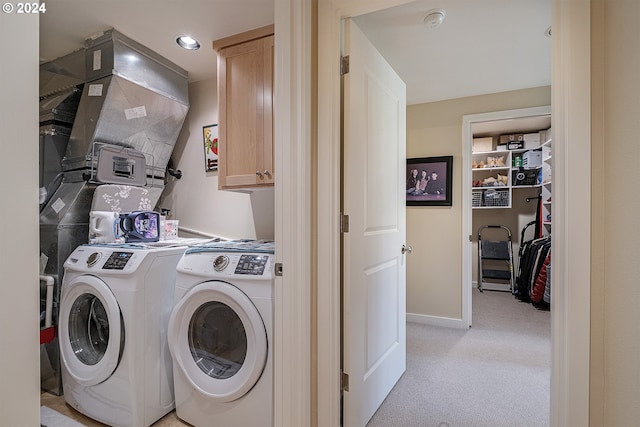 laundry room featuring cabinets and separate washer and dryer