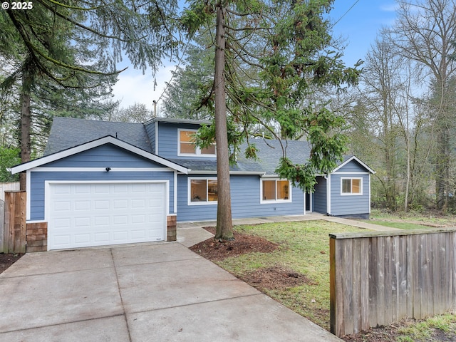 view of front of home featuring a garage and a front lawn