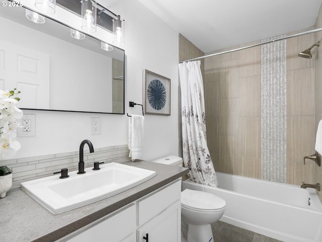 full bathroom with vanity, shower / bath combo with shower curtain, and toilet