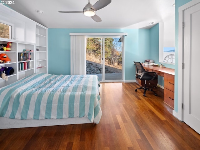 bedroom with built in desk, ceiling fan, hardwood / wood-style flooring, and access to exterior