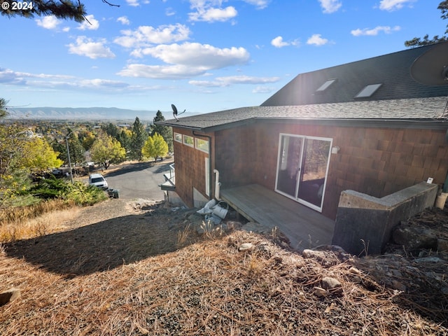 view of home's exterior with a mountain view