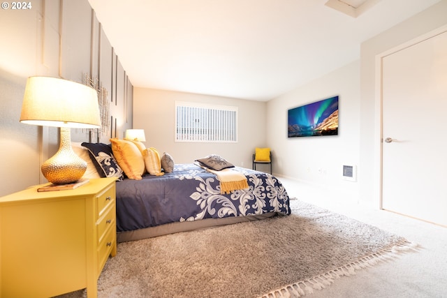 bedroom with light colored carpet