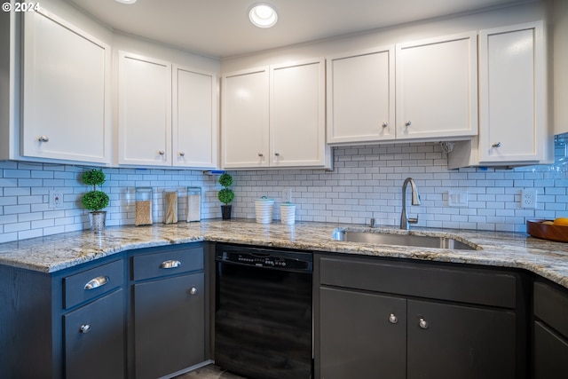 kitchen with white cabinetry, backsplash, dishwasher, and sink