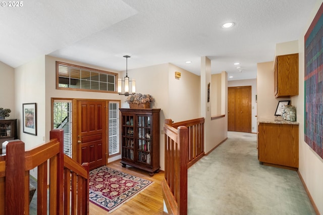6864 SW Alden St, Portland, OR 97223 - entrance foyer with a textured ceiling, a chandelier, baseboards, recessed lighting, and light wood finished floors