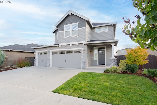 view of front of home with a front yard and a garage