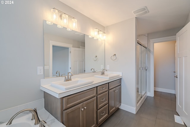 bathroom featuring vanity and a shower with shower door