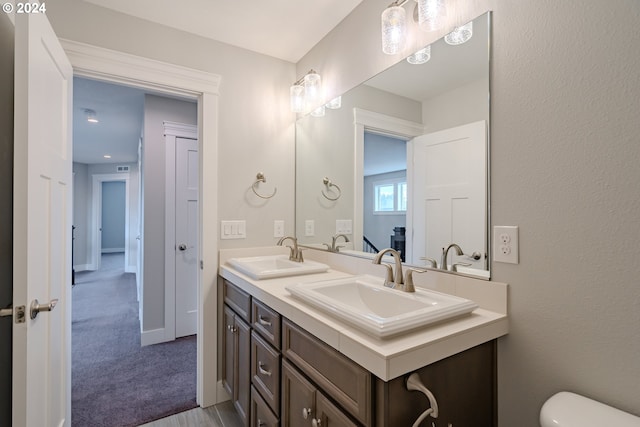 bathroom with vanity and toilet