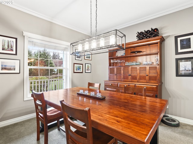 dining area with dark colored carpet and ornamental molding