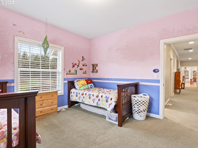 bedroom featuring crown molding and carpet floors