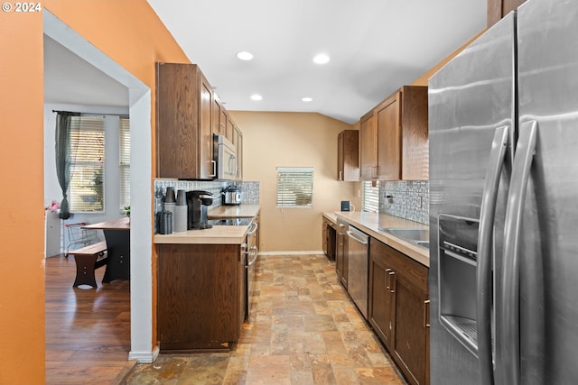 425 NW 3rd Ave, Canby, OR 97013 - kitchen featuring appliances with stainless steel finishes, baseboards, decorative backsplash, light countertops, and recessed lighting
